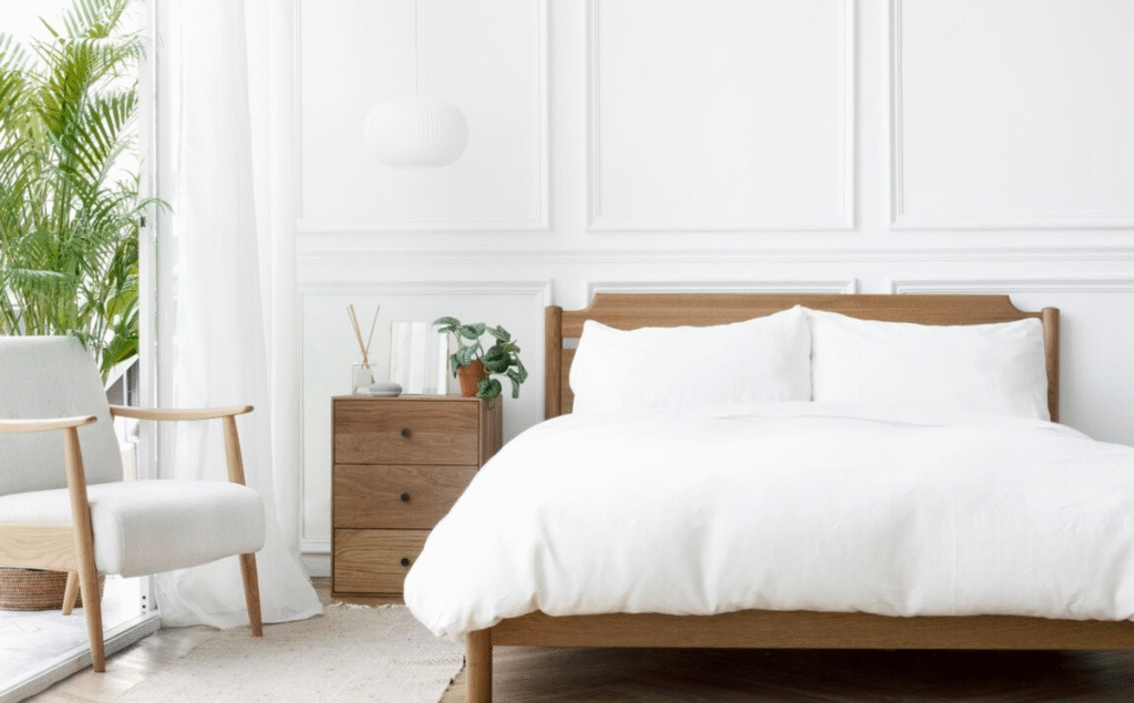 A_bedroom_with_a_white_color_tone_and_green_plant_27b4f521-790a-4498-8832-75780f29529c_1200x1200.png