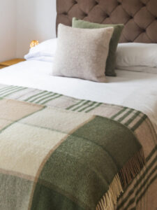 block_check_olive_on_bed_2_grande.jpg