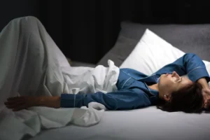 thoughtful_mature_woman_blue_pajamas_1.webp.webp
