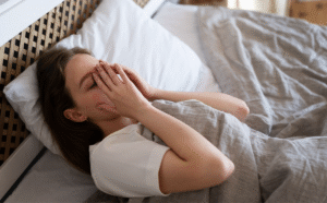 High_angle_anxious_woman_laying_in_bed_1200x1200.png
