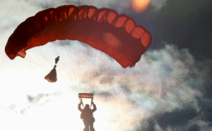 Person_Riding_on_Red_Parachute_80059af9-b461-4c8e-9bab-81024d83bc30_1200x1200.png