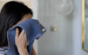 a_girl_using_blue_face_towel_1200x1200.png