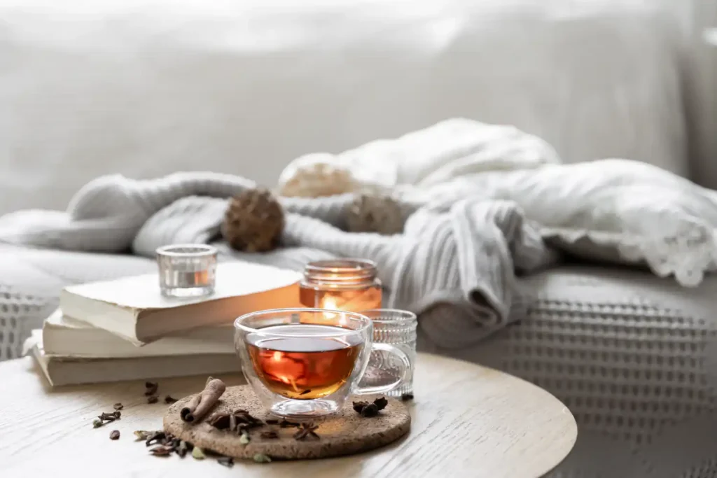 still_life_with_cup_tea_books_candle_candlestick_1.webp.webp