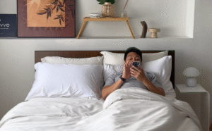 A_man_watching_his_phone_on_the_bed_4fb90025-06fc-460d-813b-46f89dfabba8_1200x1200.png
