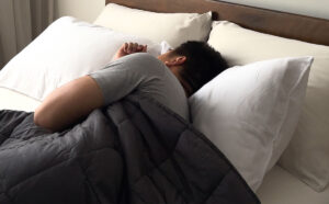 Dan_from_Weavve_Home_sleeping_with_a_weighted_blanket_1200x1200.jpg