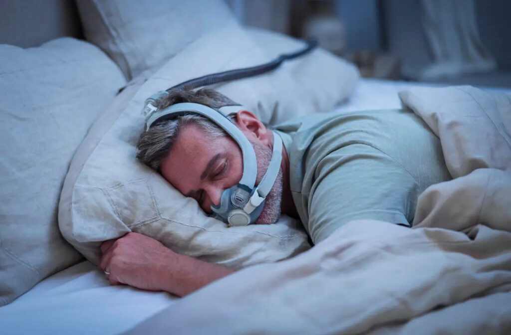 blog_cover_man-sleeping-with-the-resmed-airtouch-f30i-comfort-full-face-cpap-mas.webp.jpeg