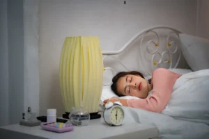 asian_young_woman_bed_bedroom_trying_wake_up_prepare_work_1.webp.webp